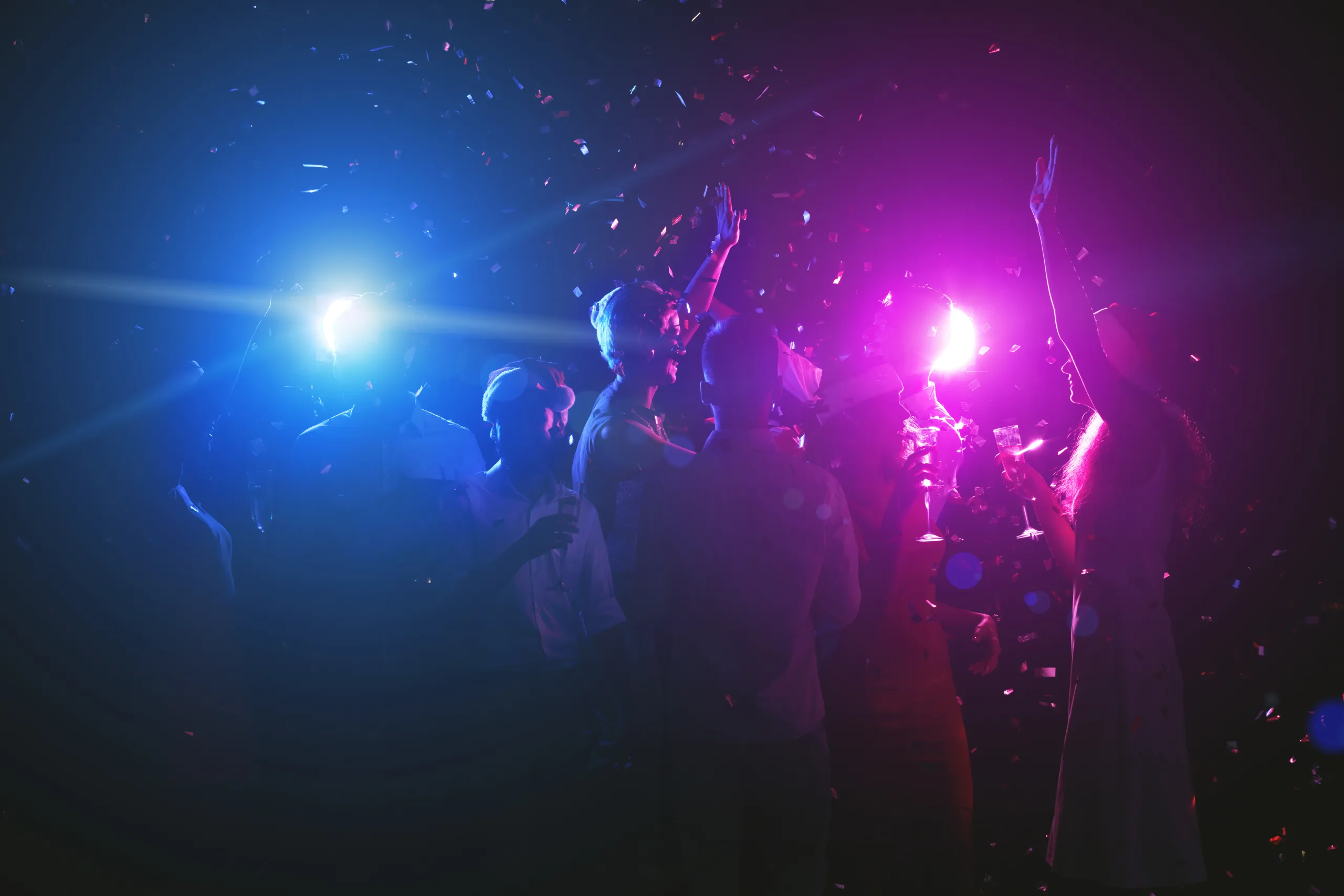 Young friends dancing while having celebration at club AdobeStock_238868766
