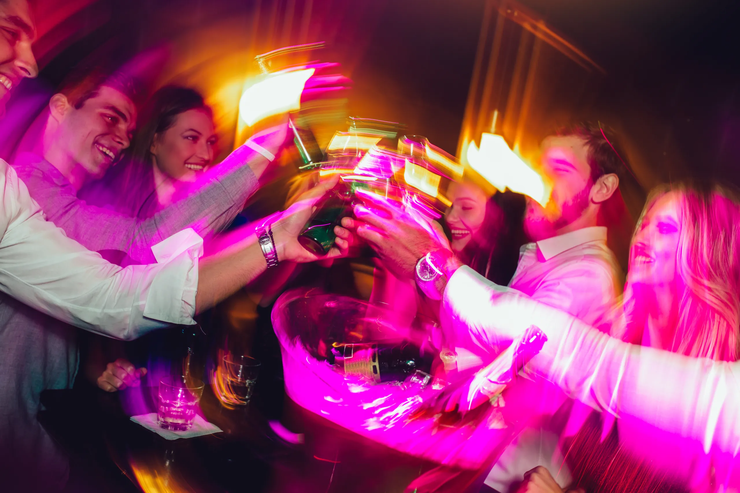 Happy young people having fun at nightclub. AdobeStock_294569918
